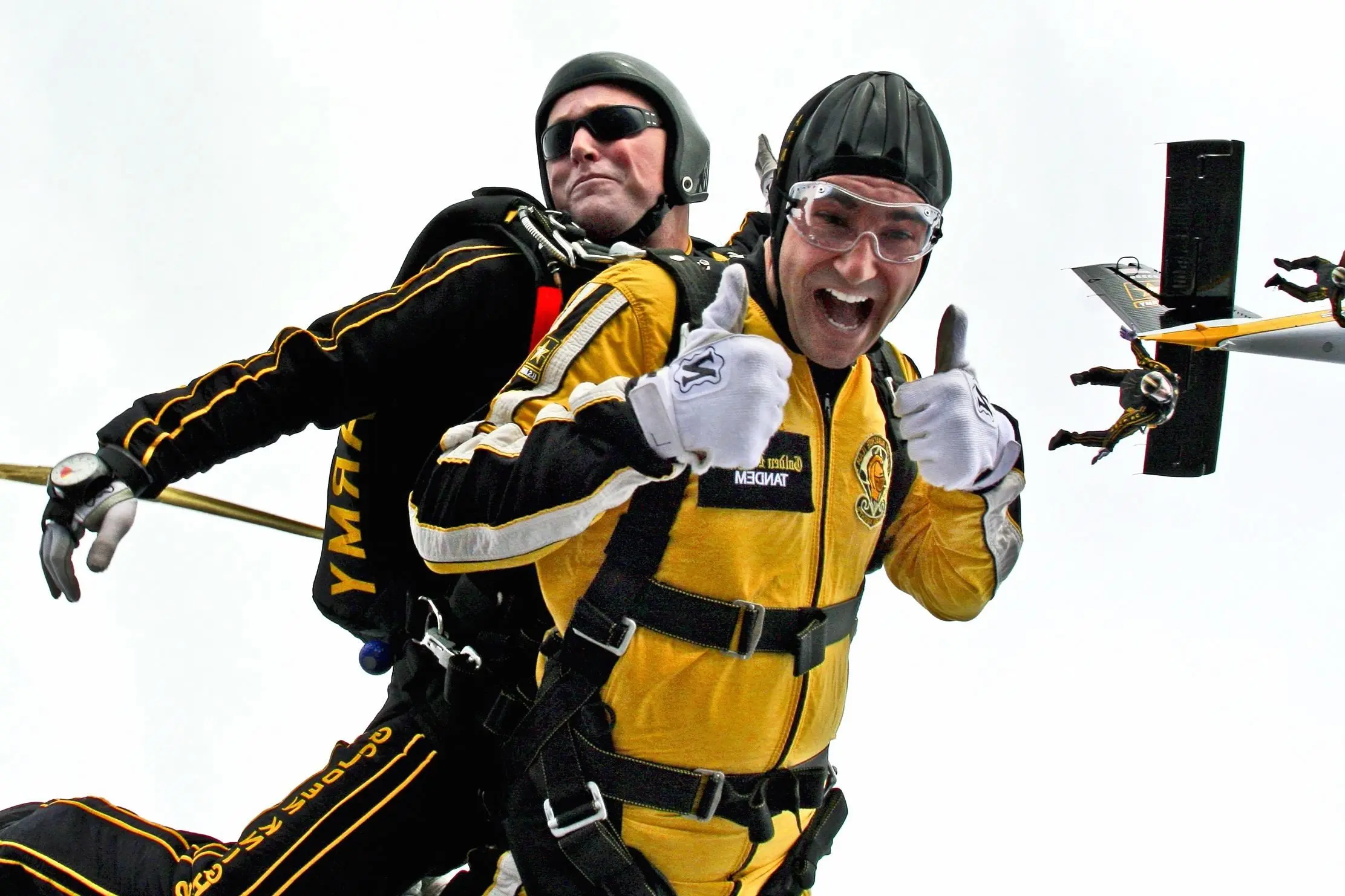 Two people tandem skydiving, illustrating how client and agency success depends on working together