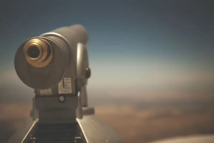 Telescope pointing to the sky, illustrating how agency evaluations bring distant relationship insights into focus